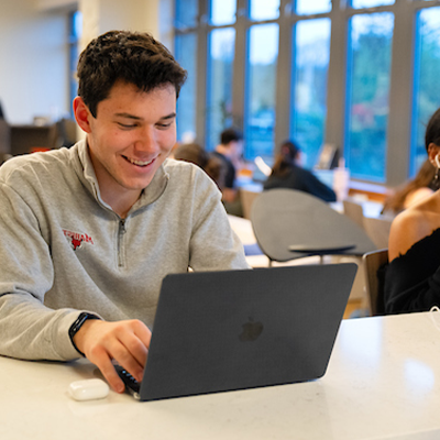 image of student with lap top